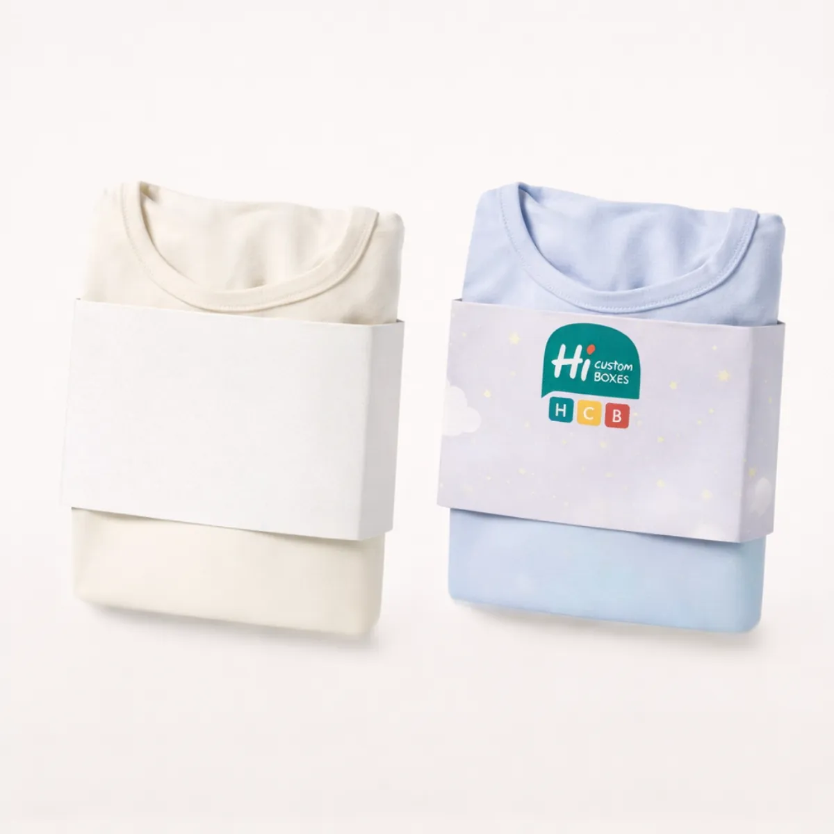 Folded white and blue sleepwear tops secured with matching paper belly bands around the middle- class=